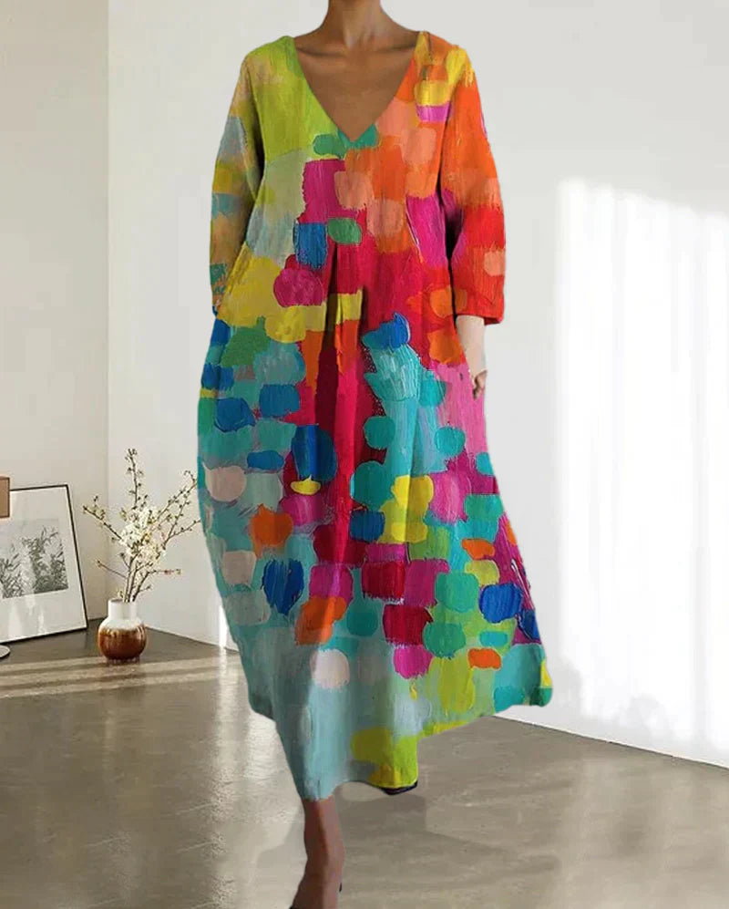 Buntes Damenkleid mit V-Ausschnitt, abstraktes Muster, lang, lässig, aus Baumwolle.