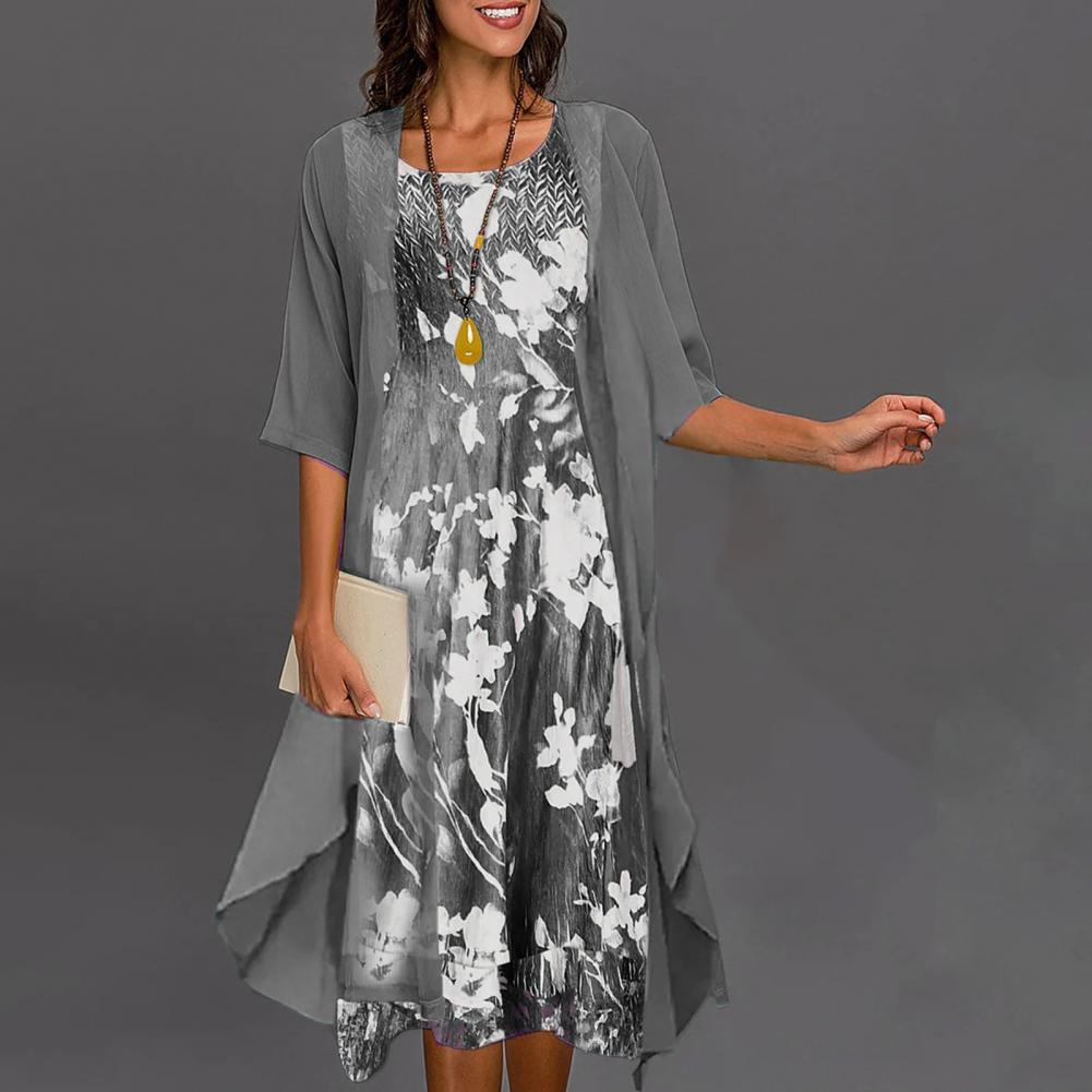 Elegantes graues Kleid mit Blumenmuster, Rundhals, große Saum, Damenmode, stilvoller Look.